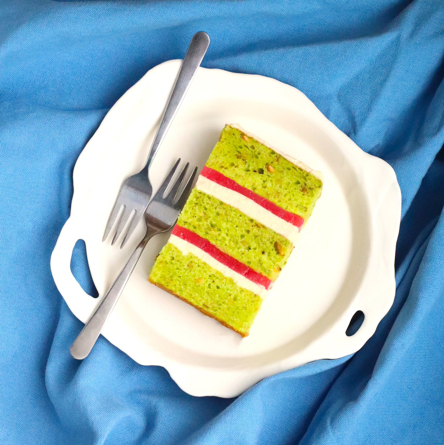 Pistachio cake, cardamom frosting & rose gel