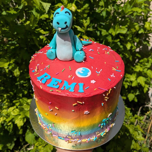 Rainbow dinosaur cake